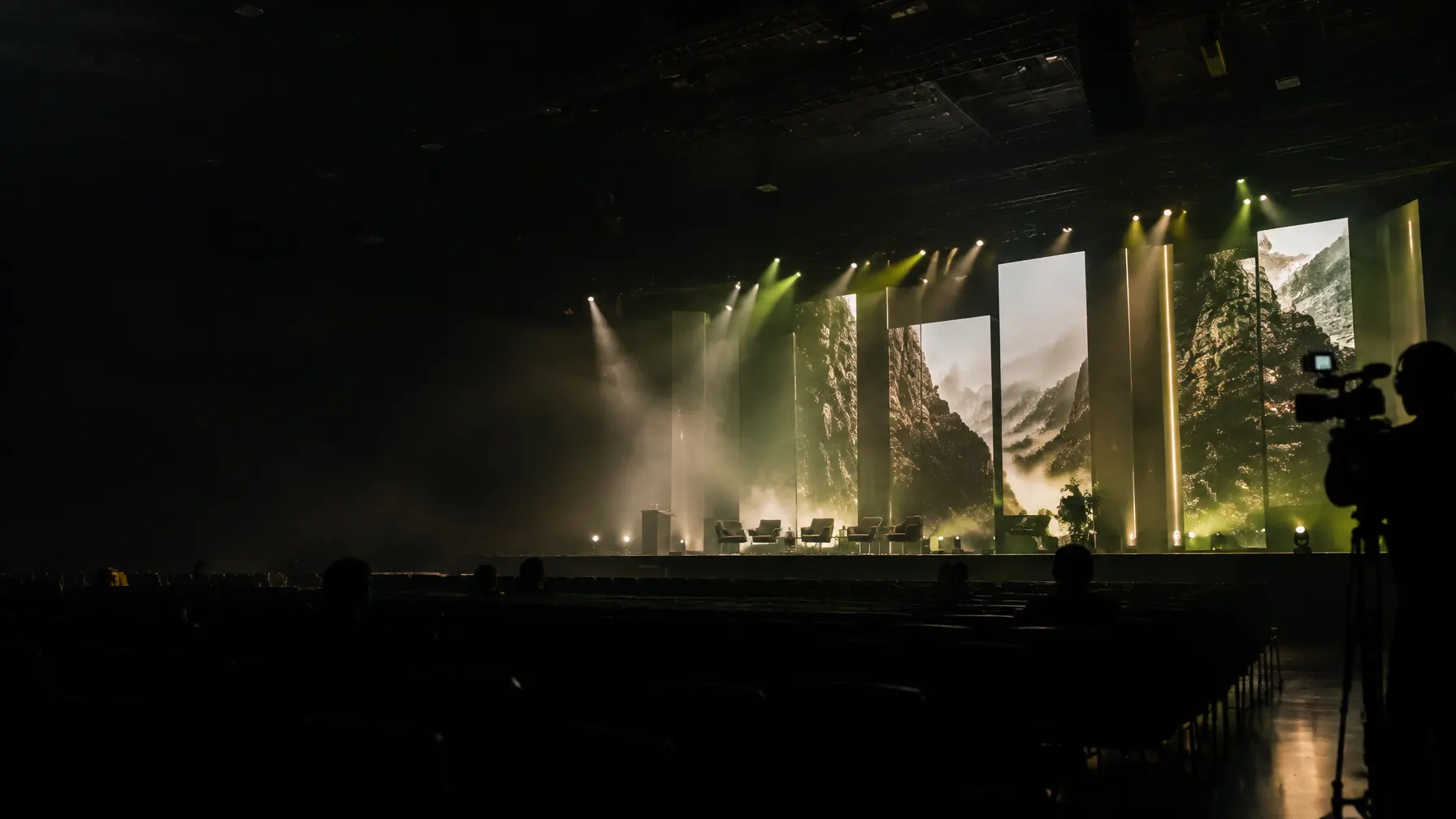 Cinematic live event stage with LED visuals and production atmosphere